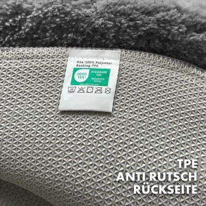 Detailaufnahme der rutschfesten Rückseite der runden, dunkelgrauen KARAT Badematte SKY, Oeko-Tex Standard 100.