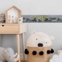 Kinderzimmer mit gelb-schwarzer PROFHOME Bordüre mit Baustellenfahrzeug-Motiv.