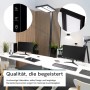 Schwarze LUXULA LED Bürostehleuchte mit Dimmfunktion und Doppelkopf-Design im modernen Büro.