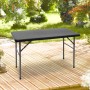 Schwarzer rechteckiger Relaxdays Klapp-Gartentisch aus Kunststoff in Rattan-Optik auf einer Holzterrasse im Garten.