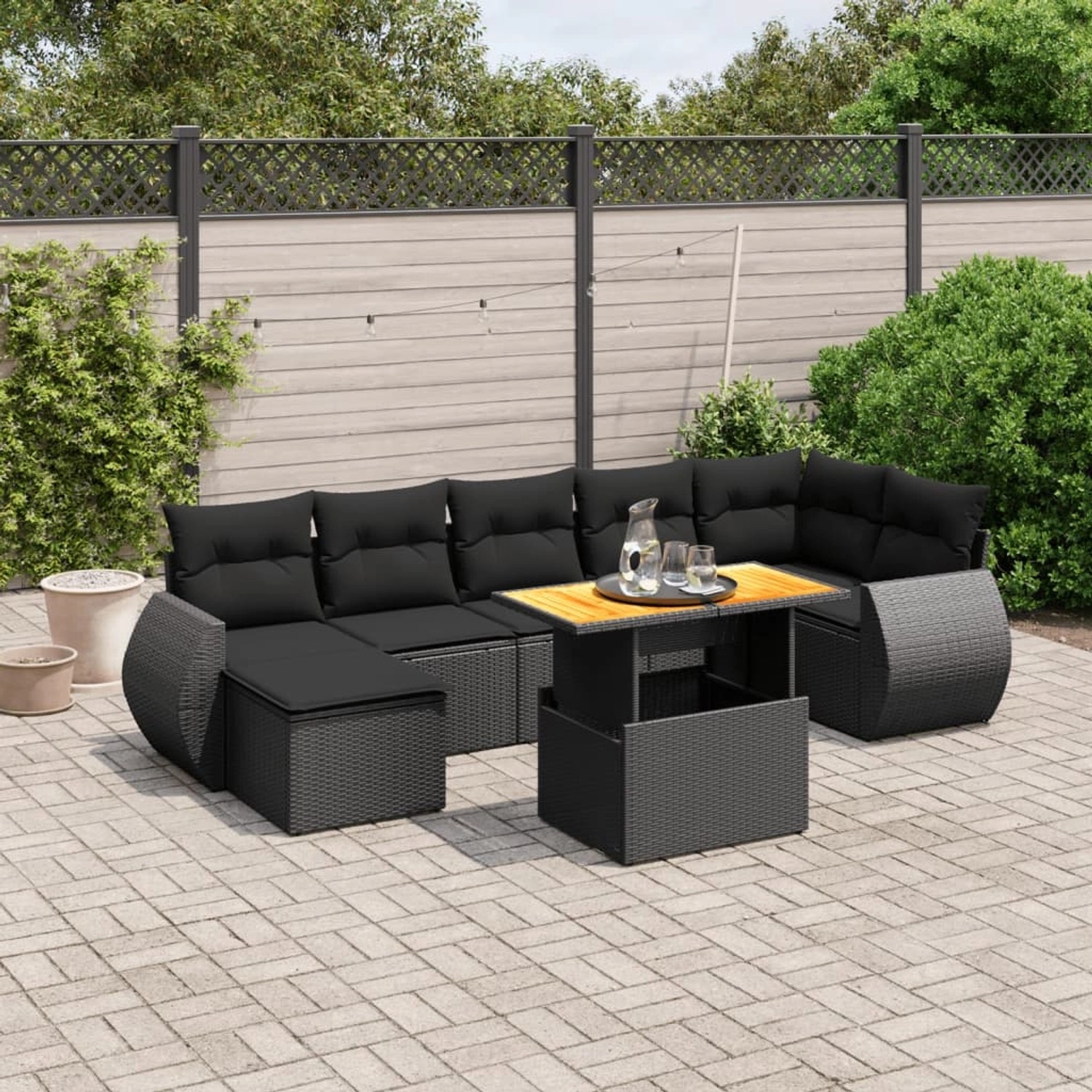 Schwarze 8-tlg. vidaXL Garten-Sofagarnitur aus Poly Rattan mit Kissen und Tisch.