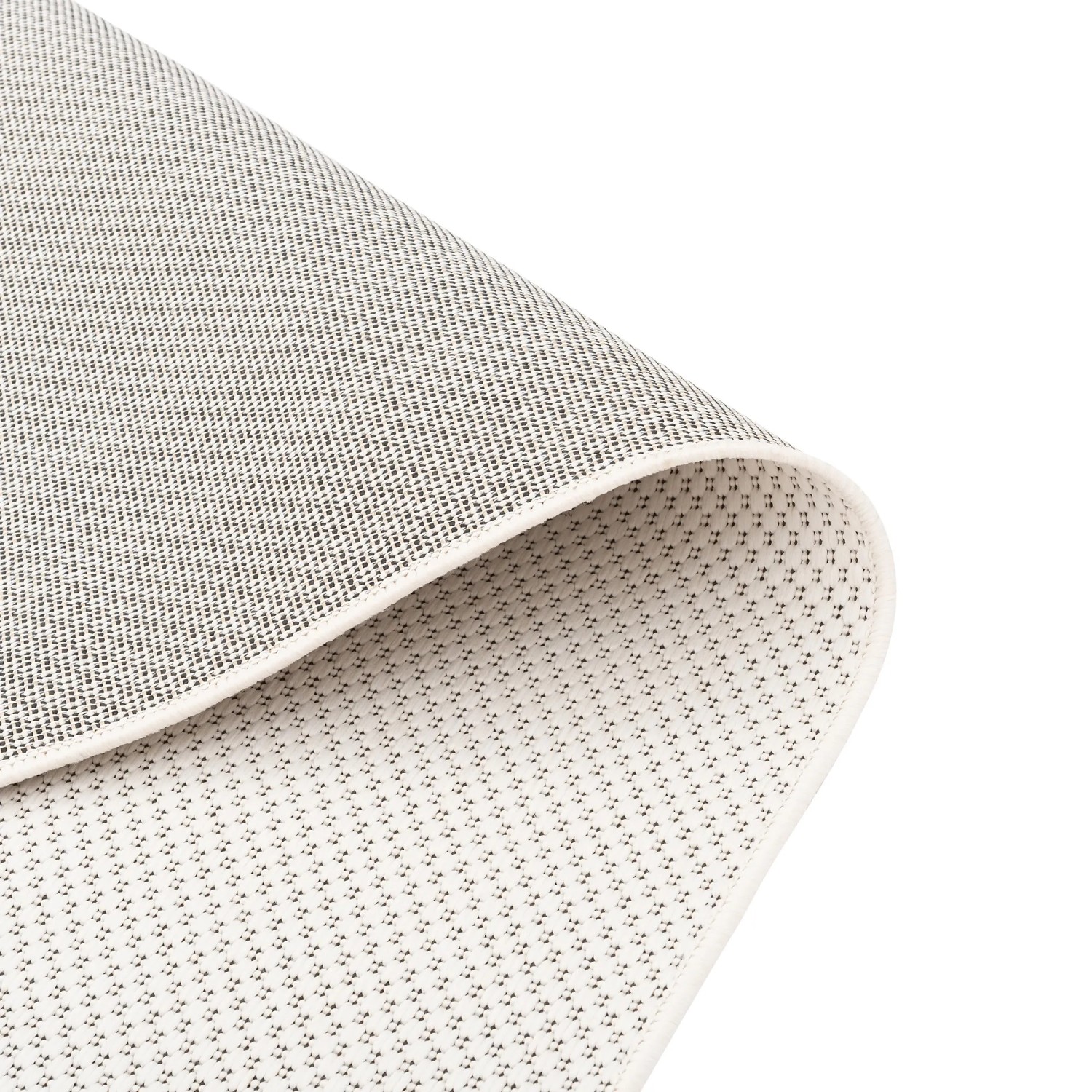 Detailaufnahme: Unterseite des creme-farbenen Teppichs Pergamon Valencia, geeignet für In- und Outdoor.
