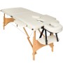 Beige Massageliege Freddi mit Holzgestell, Armlehnen und Kopfstütze. Ideal für Wellness und Entspannung.