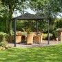 Palram Palermo Gartenpavillon 3x3 in Anthrazit mit LED-Set, inklusive Tisch und Stühlen im Garten.