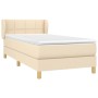 Cremefarbenes Boxspringbett 100x200 cm mit Matratze und Kopfteil.