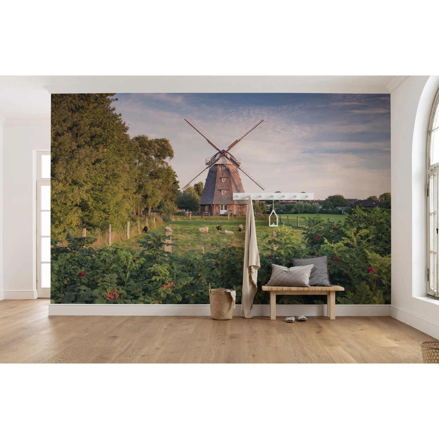 Vlies Fototapete „Tage wie Diese“ mit Windmühle, Landschaft und Bank im Raum.