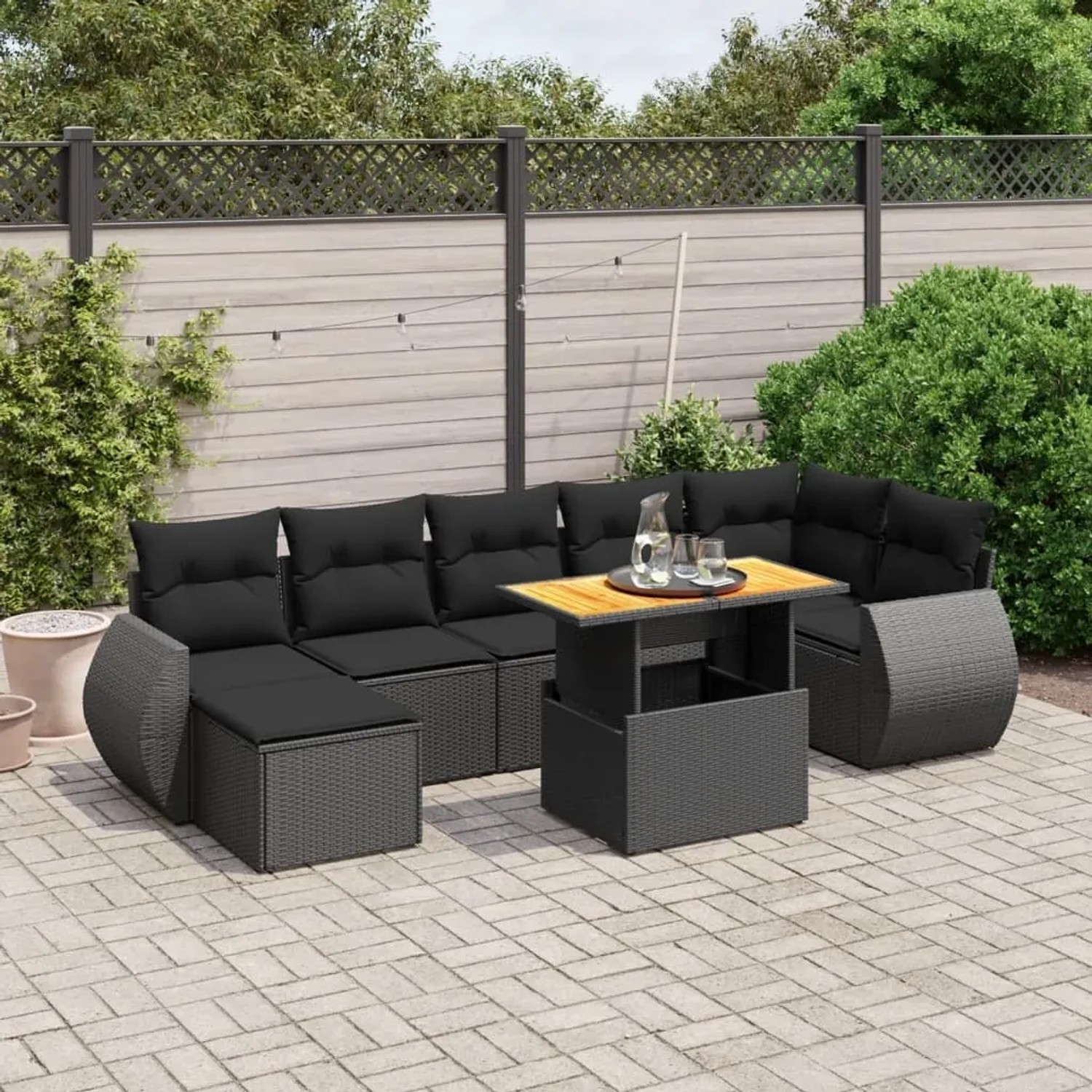 Schwarze 8-tlg. vidaXL Garten-Sofagarnitur aus Poly Rattan mit Tisch und Kissen.