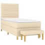 Cremefarbenes Boxspringbett (80x200 cm) mit Matratze und Bank, Stoffbezug.