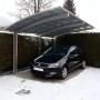 Ximax Carport Portoforte-110 im Edelstahl-Look mit Auto im Winter.