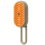 PETSATION 3-in-1 Dampfbürste für Hunde & Katzen. Ovale Form, orange Silikonborsten, beiges Gehäuse.