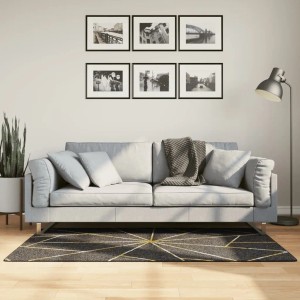 vidaXL Teppich, schwarz und golden, 80x150 cm, rutschfest, mit geometrischem Muster vor Sofa