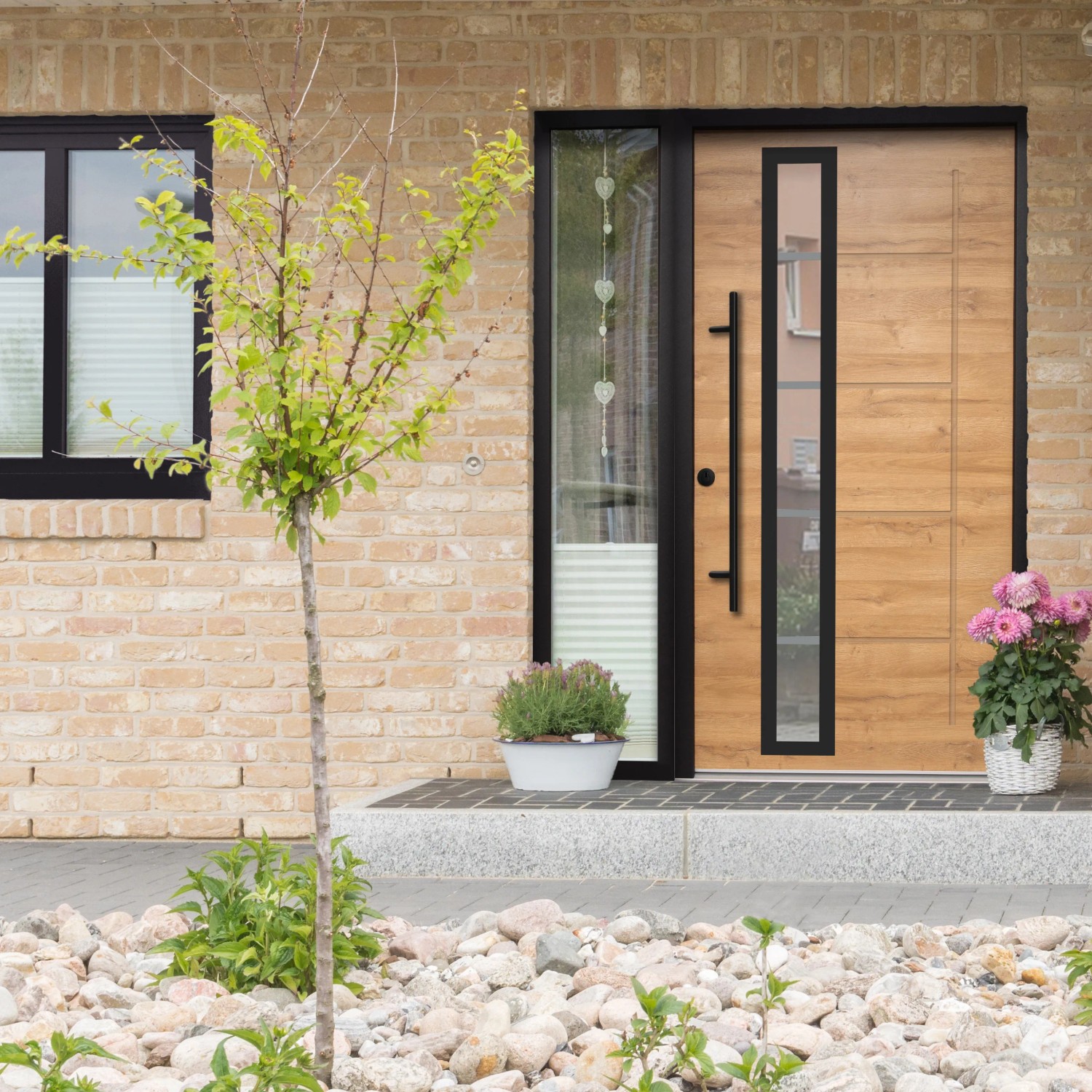 Splendoor Sicherheitshaustür Thermospace Paris Prime RC2 in Eiche Natur mit Glaselement und schwarzem Rahmen.