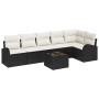 Schwarzes 7-teiliges Garten-Sofa-Set aus Poly Rattan mit Tisch und Kissen.