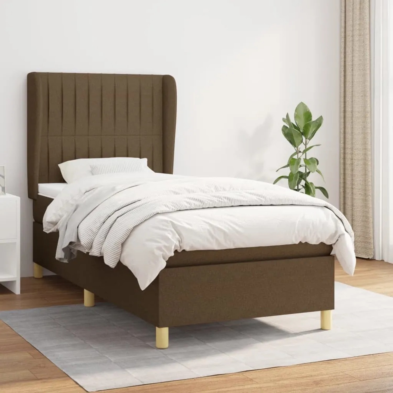 Boxspringbett dunkelbraun (90x200 cm) mit Matratze und Kopfteil.