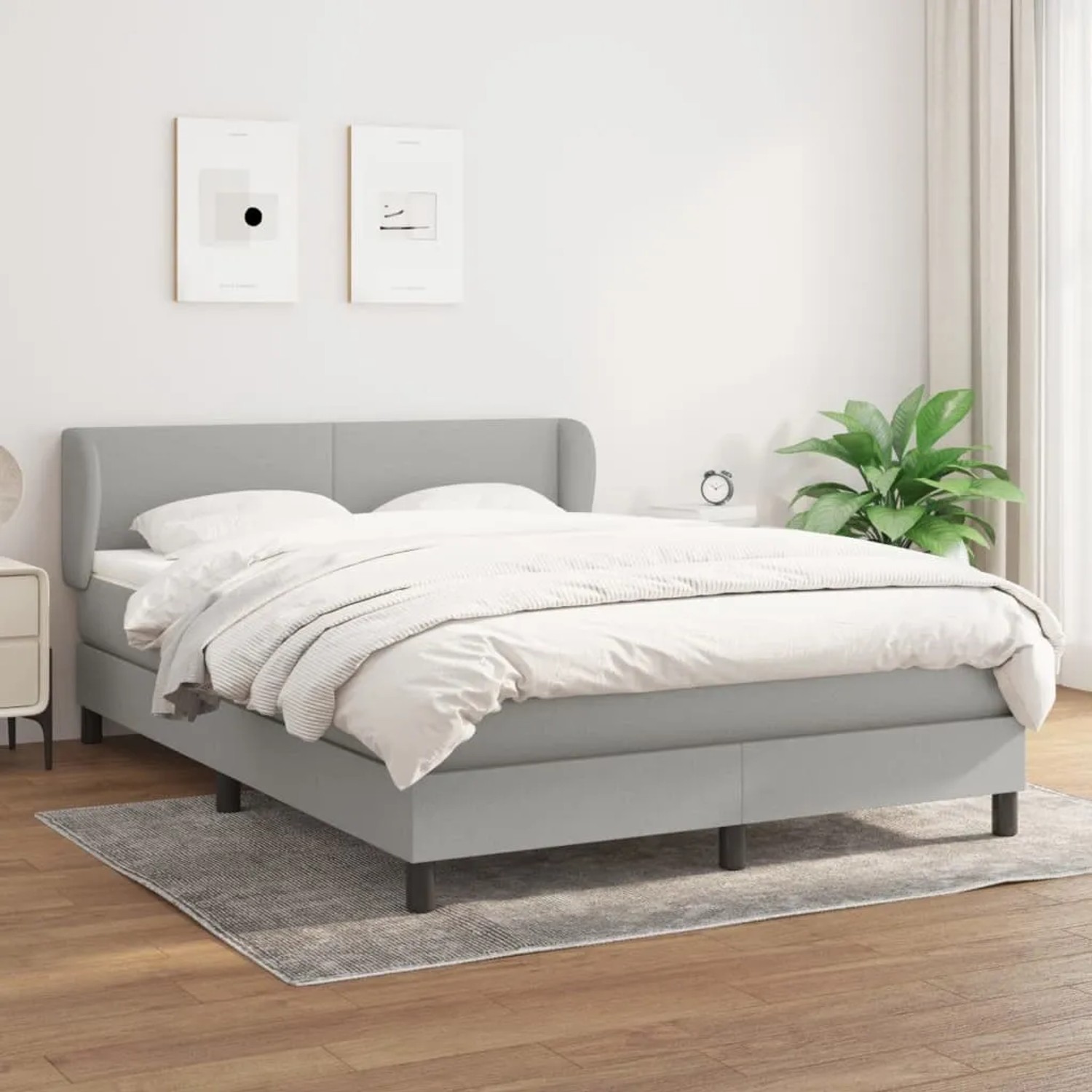 Hellgraues vidaXL Boxspringbett (140x200 cm) mit Matratze und Kopfteil im Schlafzimmer.