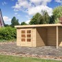 Unbehandeltes Karibu Holz-Gartenhaus Kumla 3 mit Pultdach und Anbau im Garten.