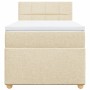 Cremefarbenes Boxspringbett 80x200 cm mit Matratze und Kopfteil.