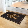 Schwarze Astra Sauberlaufmatte mit goldener "Home sweet Home" Schrift, 40x60 cm.
