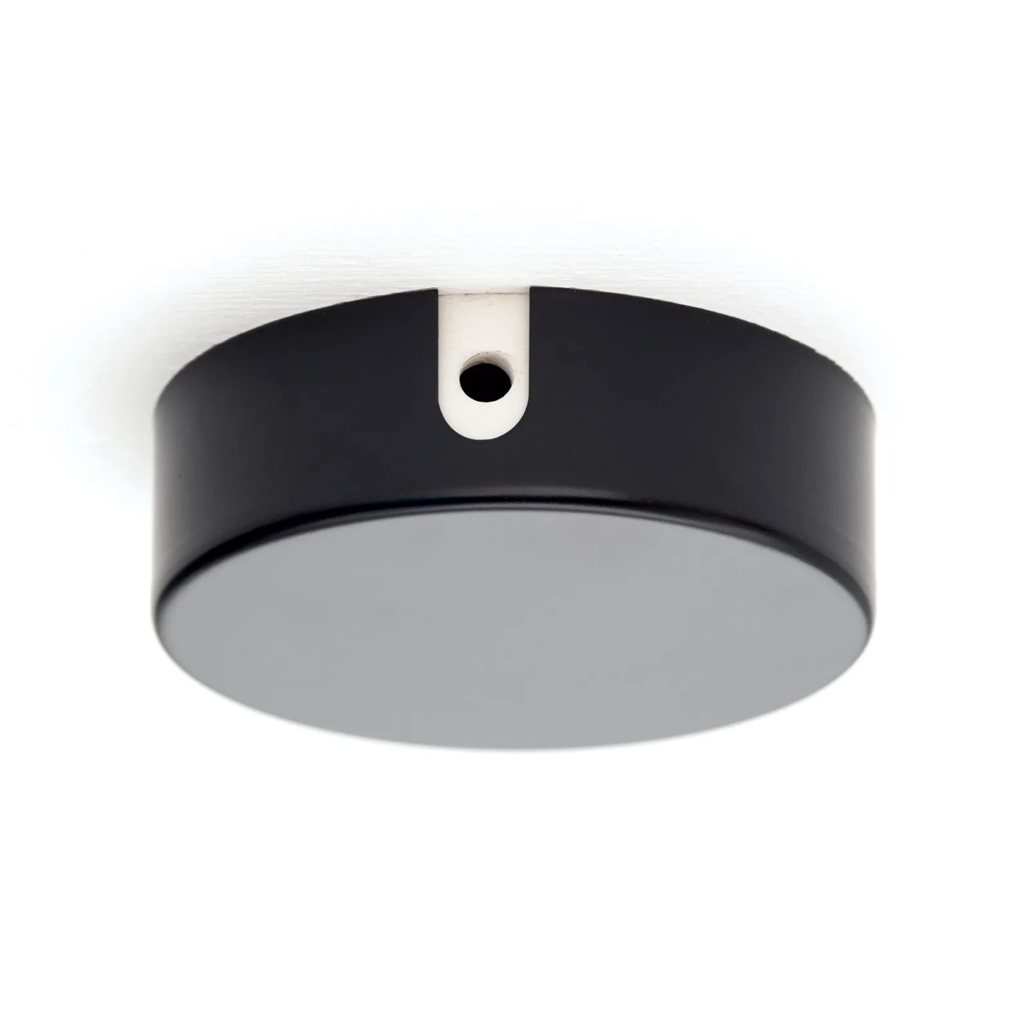 Schwarze Orion Lightstyle Verteilerdose aus Metall (Ø 70 mm) zur Kabelverdeckung an Decken.
