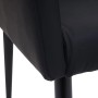 Detailaufnahme: Schwarzer MCW Esszimmerstuhl aus Kunstleder, Fokus auf Polsterung und Bein.