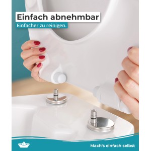 Detailaufnahme: Abnehmbarer, weißer WC-Sitz mit Absenkautomatik für einfache Reinigung.