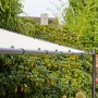 Grauer Siena Garden Pavillon Levino (300x400 cm) mit schrägem Dach im Garten.