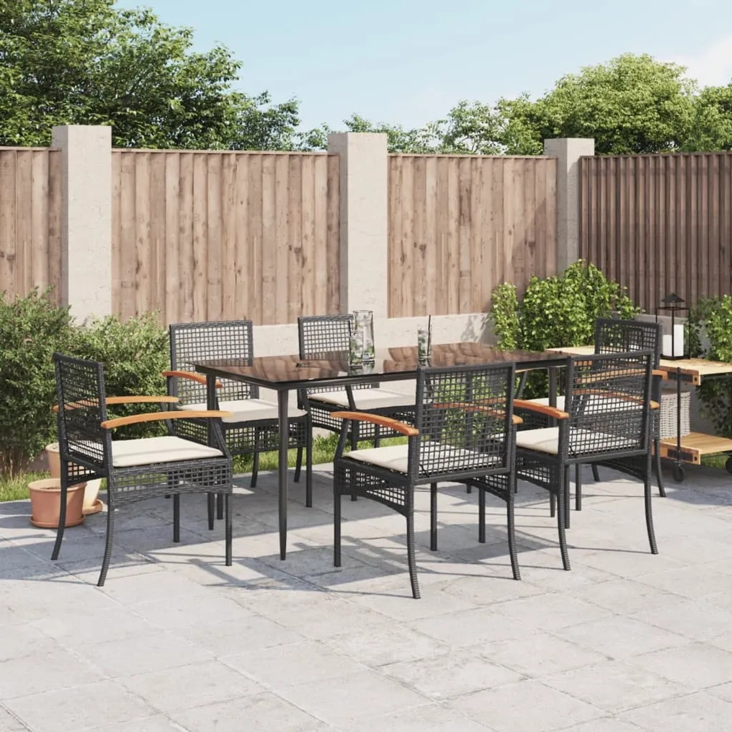 Schwarze 7-tlg. vidaXL Garten-Essgruppe aus Polyrattan mit Tisch, 6 Stühlen und Kissen.