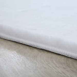Detailaufnahme: Weißer, runder Ayyildiz Kurzflorteppich Pouffy (Ø 120 cm) mit weichem Flor.