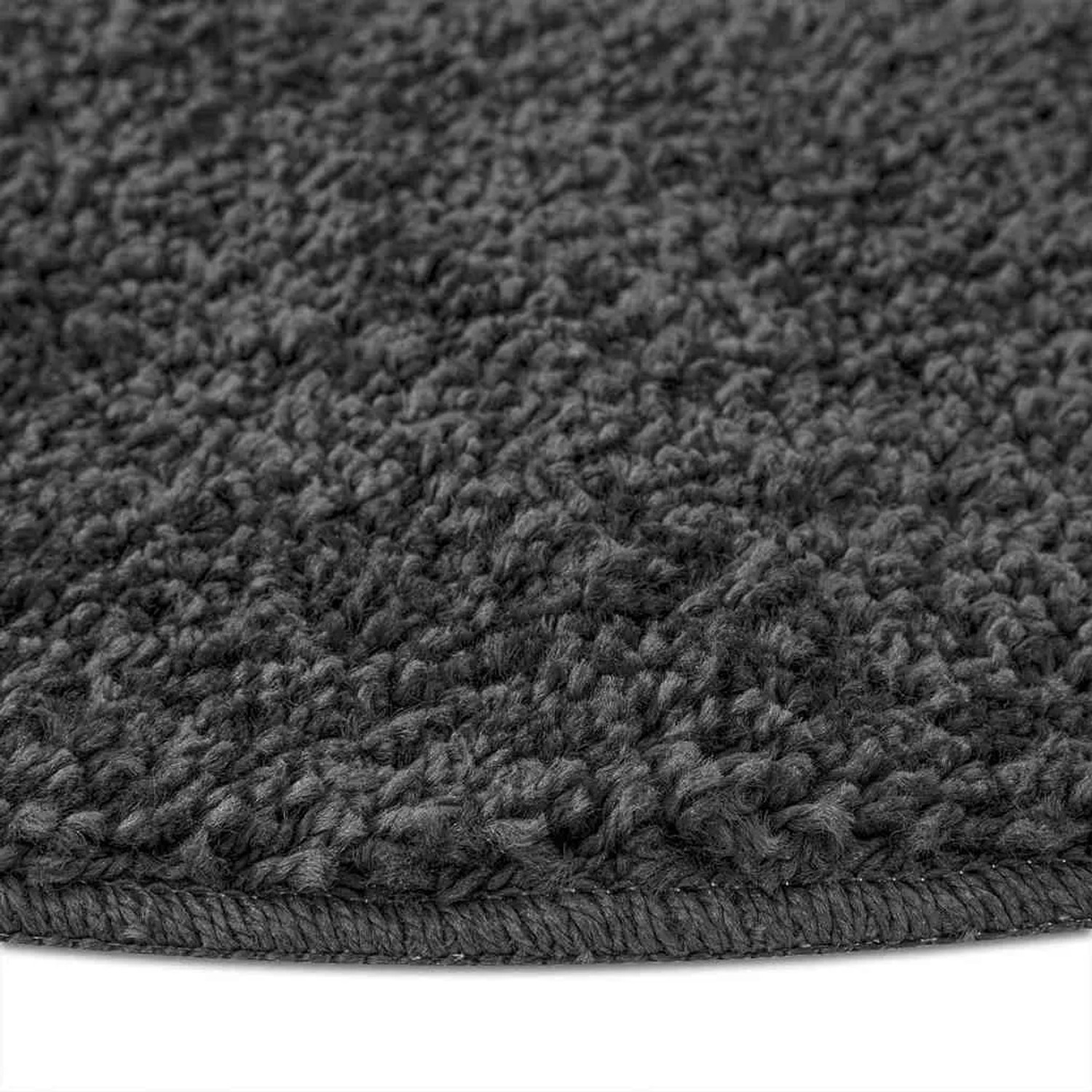 Dunkelgrauer Shaggy Teppich, Hochflor, mit flauschiger Textur und runder Kante. Rutschfestes PP-Material.