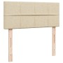 Cremefarbenes Boxspringbett Kopfteil mit Holzfüßen, Stoffbezug. Passend zu Betten 120x190 cm.