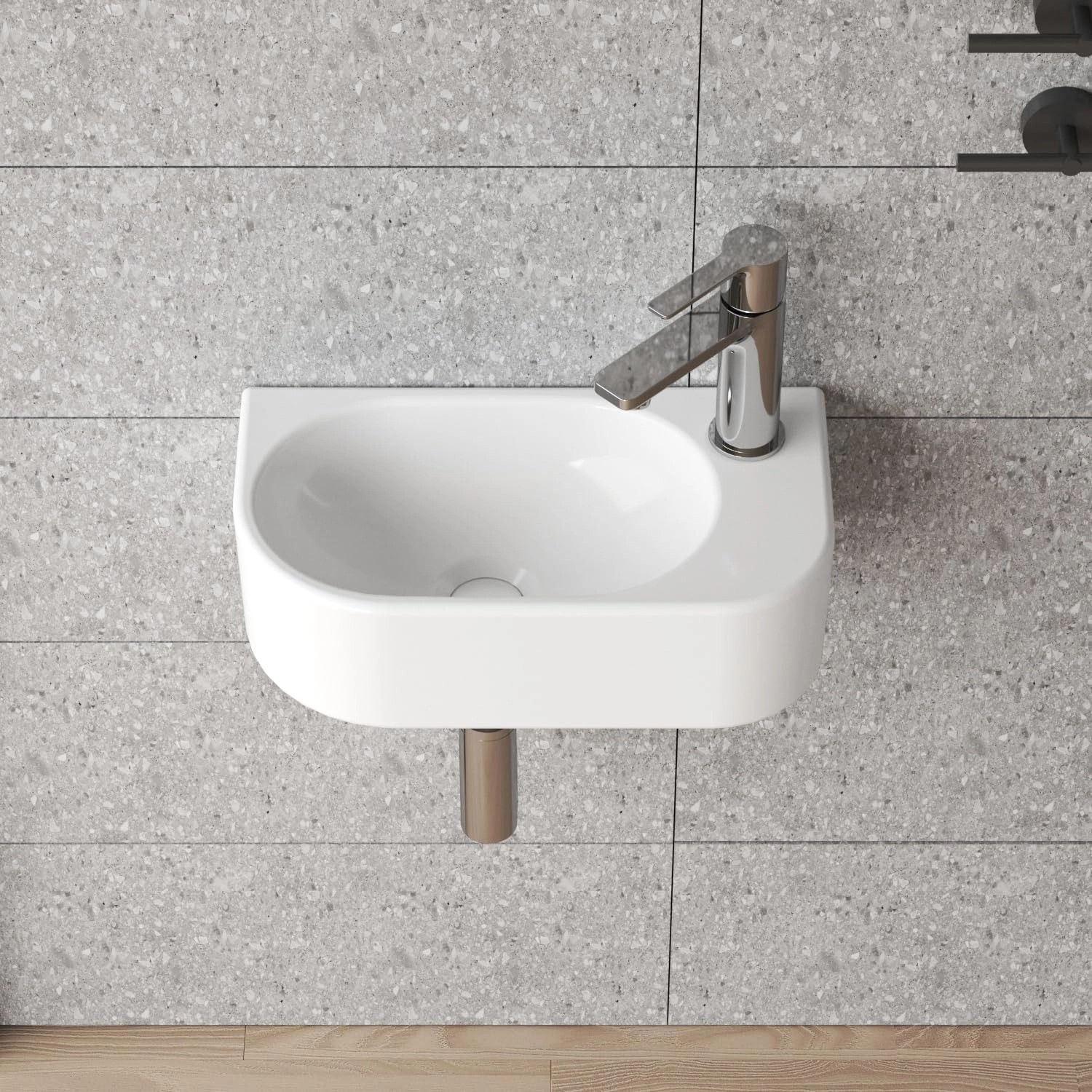 Weißes Aquabatos Handwaschbecken mit Armatur, ideal für kleine Bäder und Gäste-WCs.