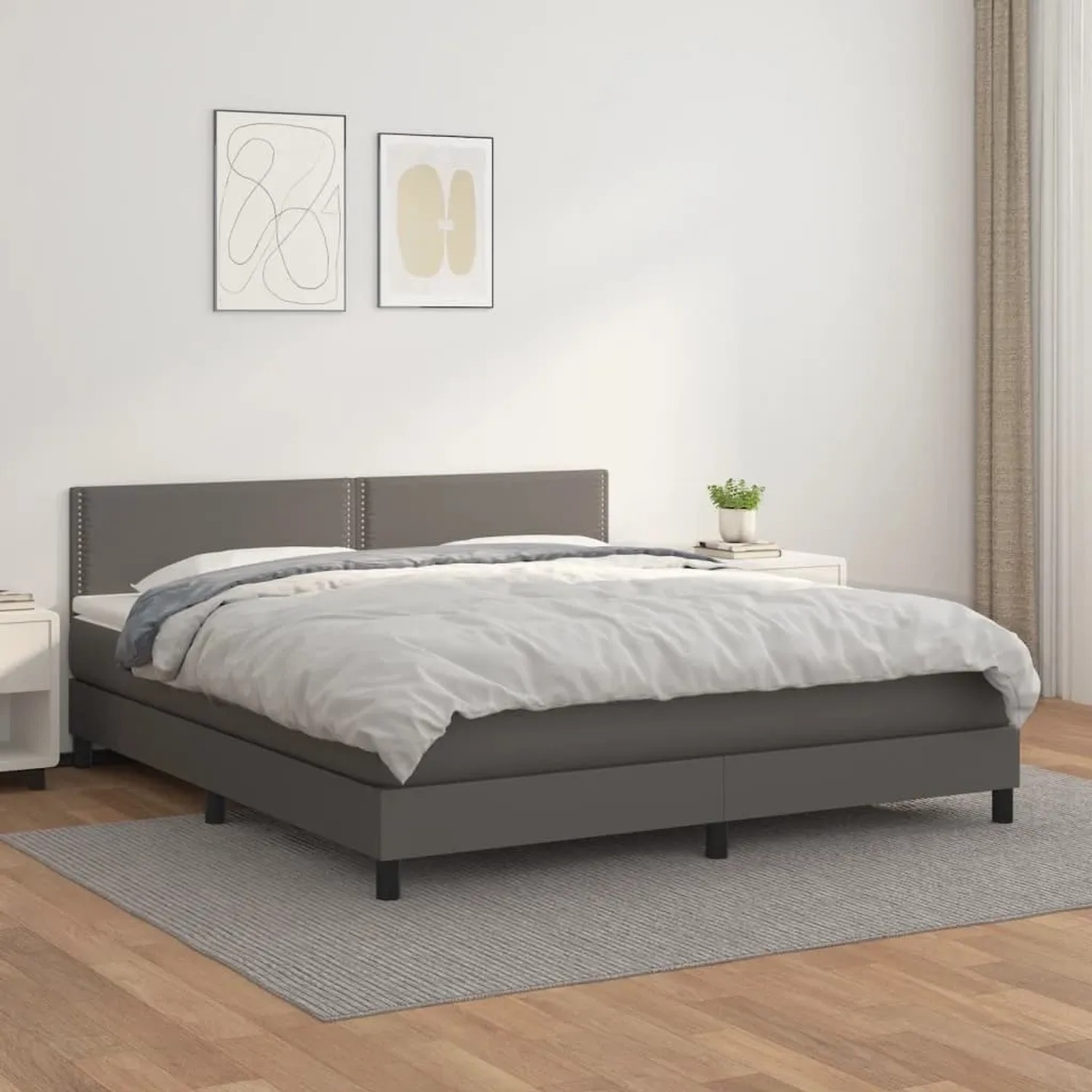 Graues vidaXL Boxspringbett mit Matratze (180x200 cm) aus Kunstleder im Schlafzimmer.