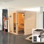 Weka Massivholzsauna Valida Eck mit Glastür, Ofen und Steuerung im Badezimmer.