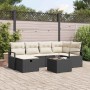 Schwarzes 7-teiliges Garten-Sofa-Set aus Poly Rattan mit Kissen und Tisch.