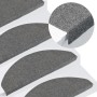 15 graue, selbstklebende VidaXL Stufenmatten (65x22,5x3,5 cm) auf einer Treppe.