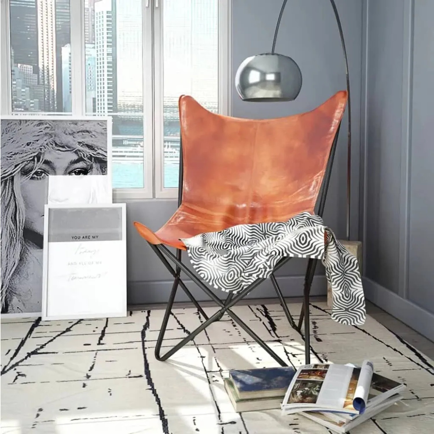 Brauner vidaXL Butterfly-Sessel aus Echtleder. Relaxsessel mit Metallgestell und Tuch.