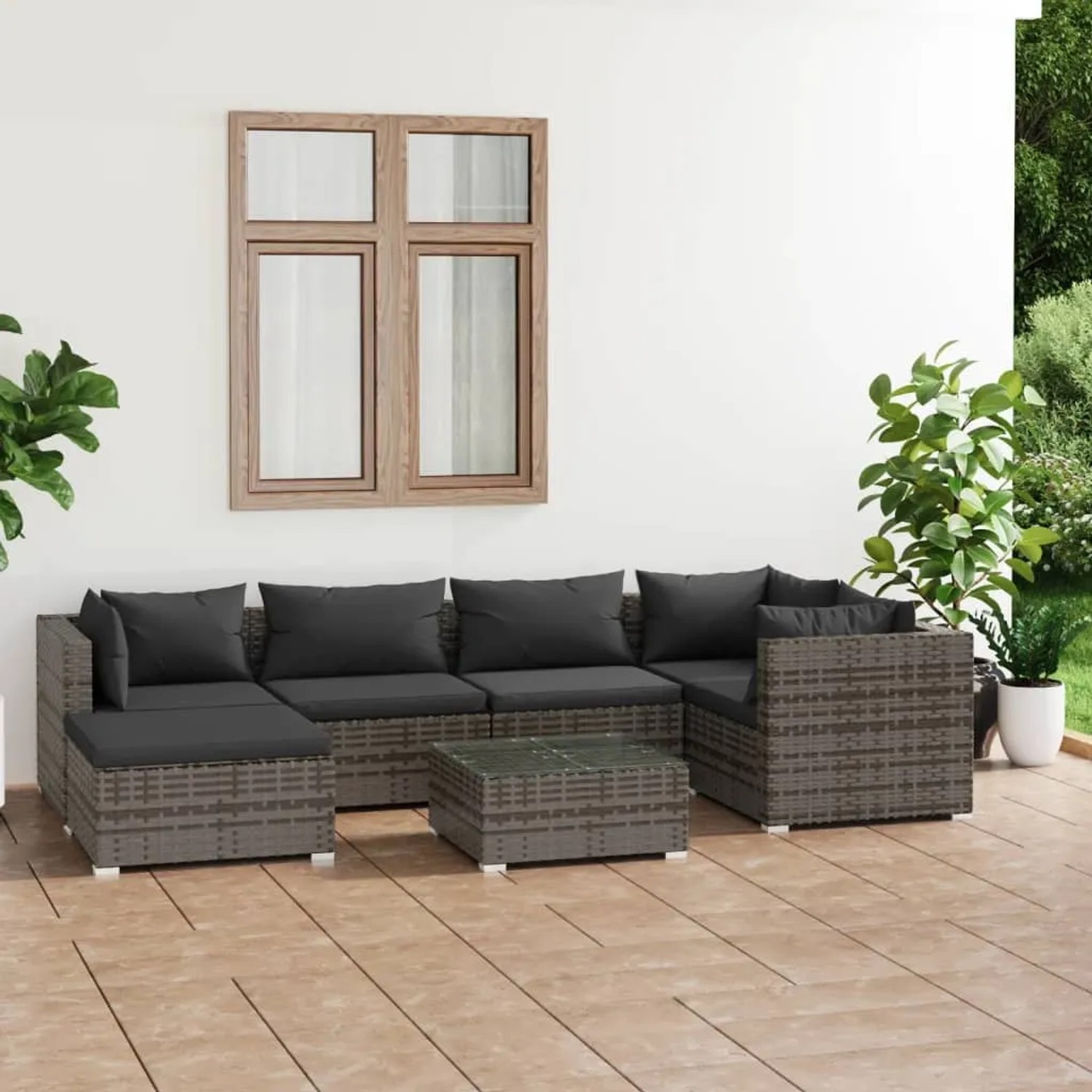 Graues 7-tlg. vidaXL Garten Lounge Set aus Polyrattan mit anthrazitfarbenen Kissen.