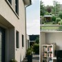 Weiße Technaxx Mini PT Outdoor-Kamera TX-390 mit Antennen, montiert außen an Hauswand und innen über Schreibtisch.