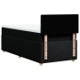 Schwarzes Boxspringbett 100x200 cm mit Matratze und Kopfteil. Bett mit Stoffbezug und Holzfüßen.