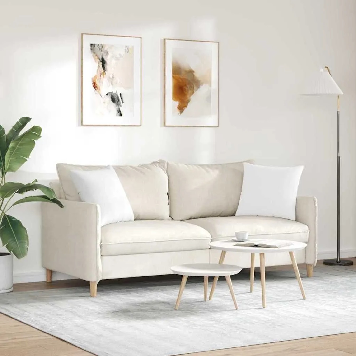 Zwei weiße Sofakissen (45x45 cm) aus Stoff von vidaXL auf einem Sofa.