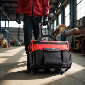 Roter Wiltec Werkzeugtrolley mit Rollen und ausziehbarem Griff, von Handwerker in Werkstatt gezogen. 19 Fächer.