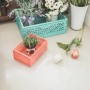 Türkise und orange Klappbox-Midi Aufbewahrungsboxen mit Dekoration.