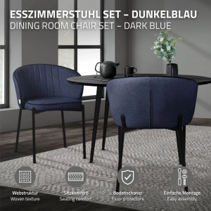 Dunkelblaue Esszimmerstühle im 4er Set mit Stoffbezug und schwarzen Beinen an einem Tisch. Modernes Design, gepolstert.
