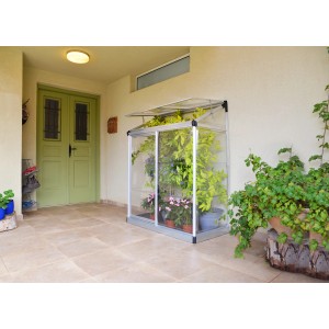 Palram Canopia Minigewächshaus Lean To, 125x64 cm, silber, an Hauswand mit Pflanzen