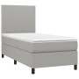 Helles Boxspringbett 90x190 cm mit Matratze und Kopfteil, Stoff hellgrau.