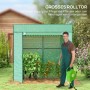 Grünes Furnicato Tomatengewächshaus mit Rolltor, Netzfenster und Mann mit Gartenschlauch.