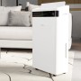 TroniTechnik Luftentfeuchter EF04 mit LED-Anzeige und 5,5l Tank vor Couch