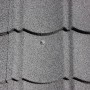 Nahaufnahme: Easypan Firstendstück in Schieferoptik, 200x120 mm, zur Dachblech-Montage.
