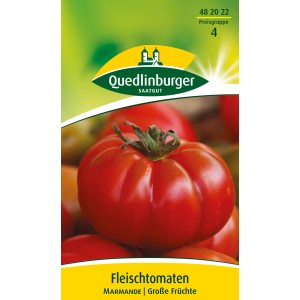 Samenpackung Quedlinburger Fleischtomate 'Marmande' mit großer, roter Tomate.