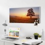 Banjado Magnettafel mit Sonnenaufgang-Motiv, weißen Magneten, an weißer Wand über Schreibtisch mit Laptop.